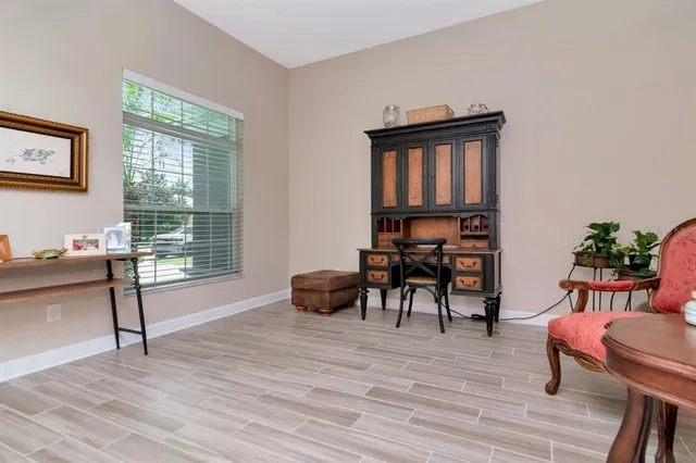 a bathroom with a granite countertop toilet and a sink