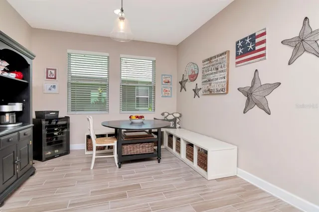 a bedroom with a bed and a flat tv screen on dresser
