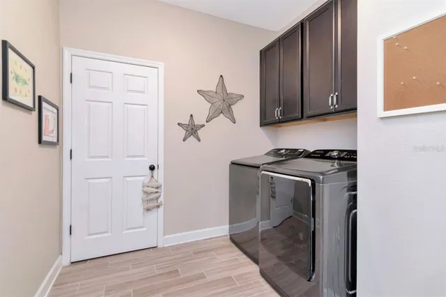 an aerial view of a house with a swimming pool yard and outdoor seating