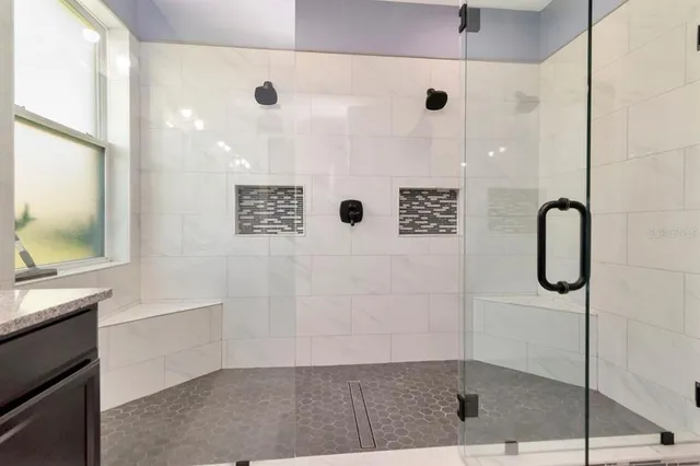 an aerial view of a house with a swimming pool