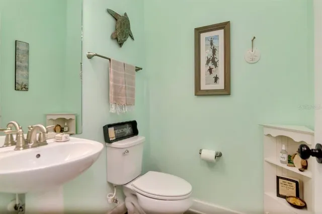 an aerial view of a house with a yard basket ball court and outdoor seating