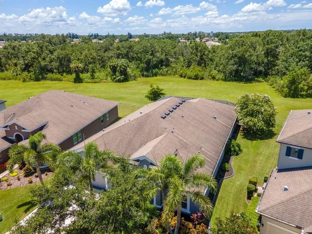 an aerial view of residential houses with swimming pool