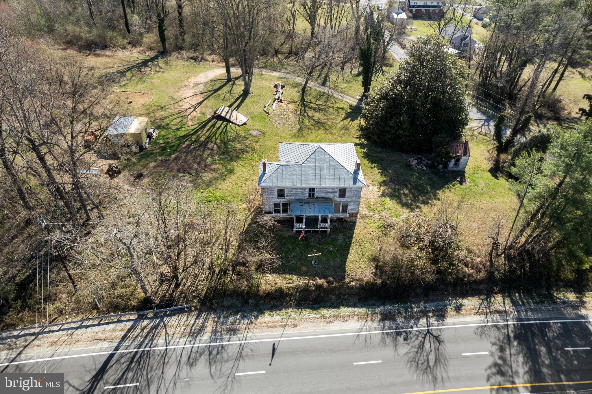 a aerial view of houses with yard