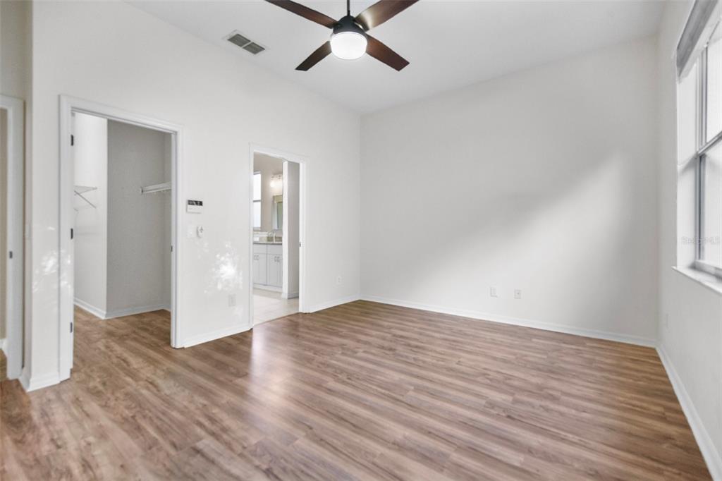 2217 Caledonian Street Clermont, FL 34711 - Photo 14 of 23 wooden floor in an empty room with a window