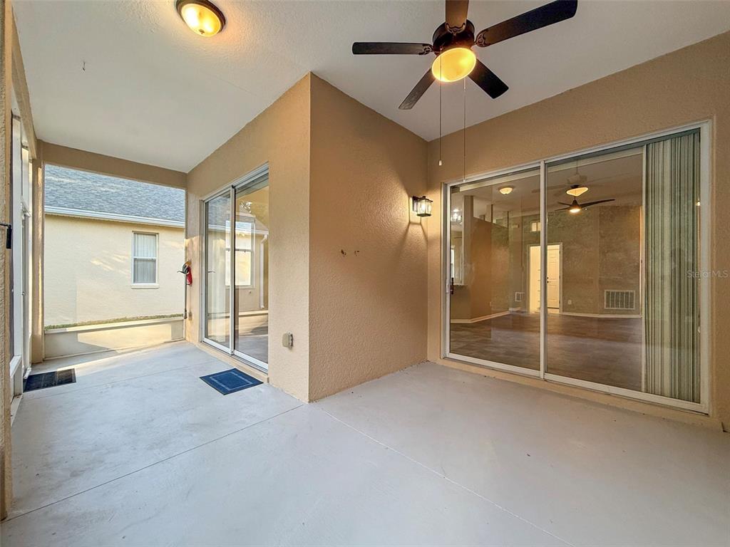 2217 Caledonian Street Clermont, FL 34711 - Photo 21 of 23 an empty room with ceiling fan and window