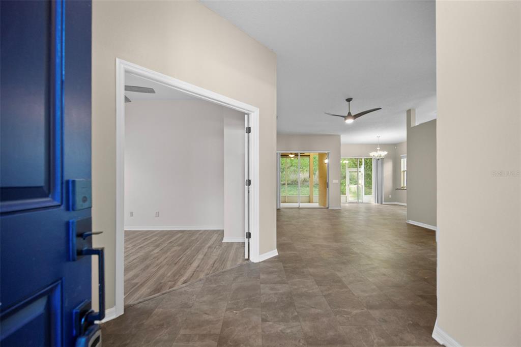2217 Caledonian Street Clermont, FL 34711 - Photo 3 of 23 a view of a hallway with wooden shelves