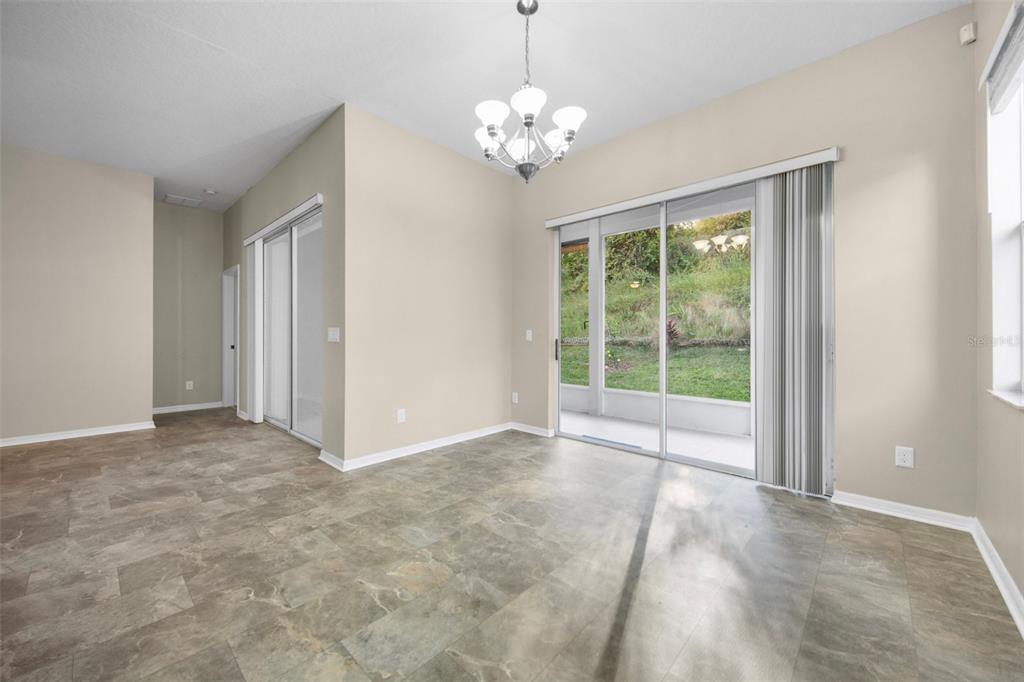 2217 Caledonian Street Clermont, FL 34711 - Photo 10 of 23 a view of a big room with windows and chandelier