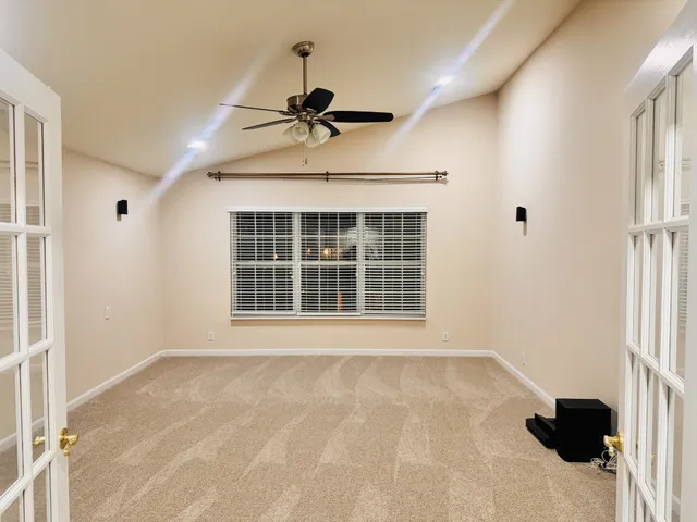 a view of an empty room with a window