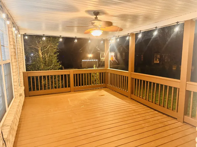 a view of a balcony with wooden floor