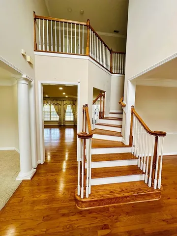 a view of entryway livingroom and hall with wooden floor