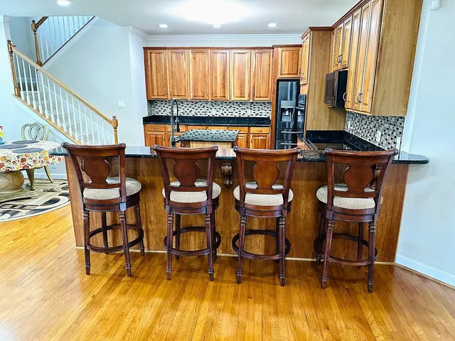 a view of a dining room with furniture and a window