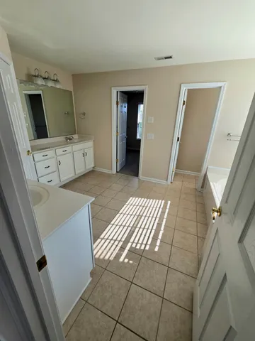a view of a hallway with washer and dryer