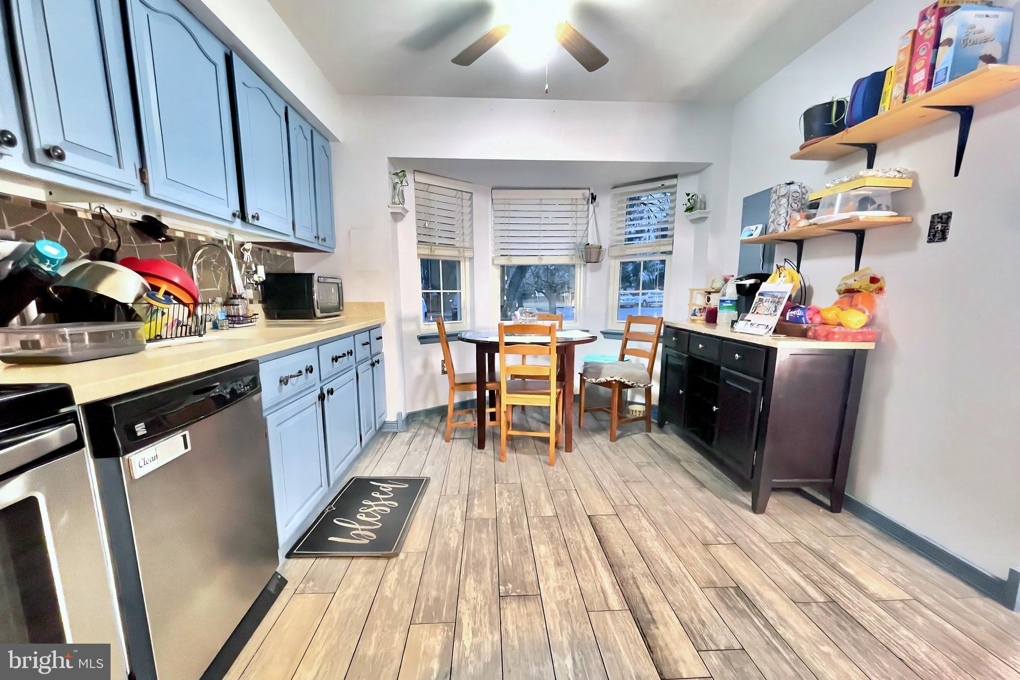 6852 Carnation Circle Frederick, MD 21703 - Photo 3 of 22 a view of a kitchen with fridge and workspace