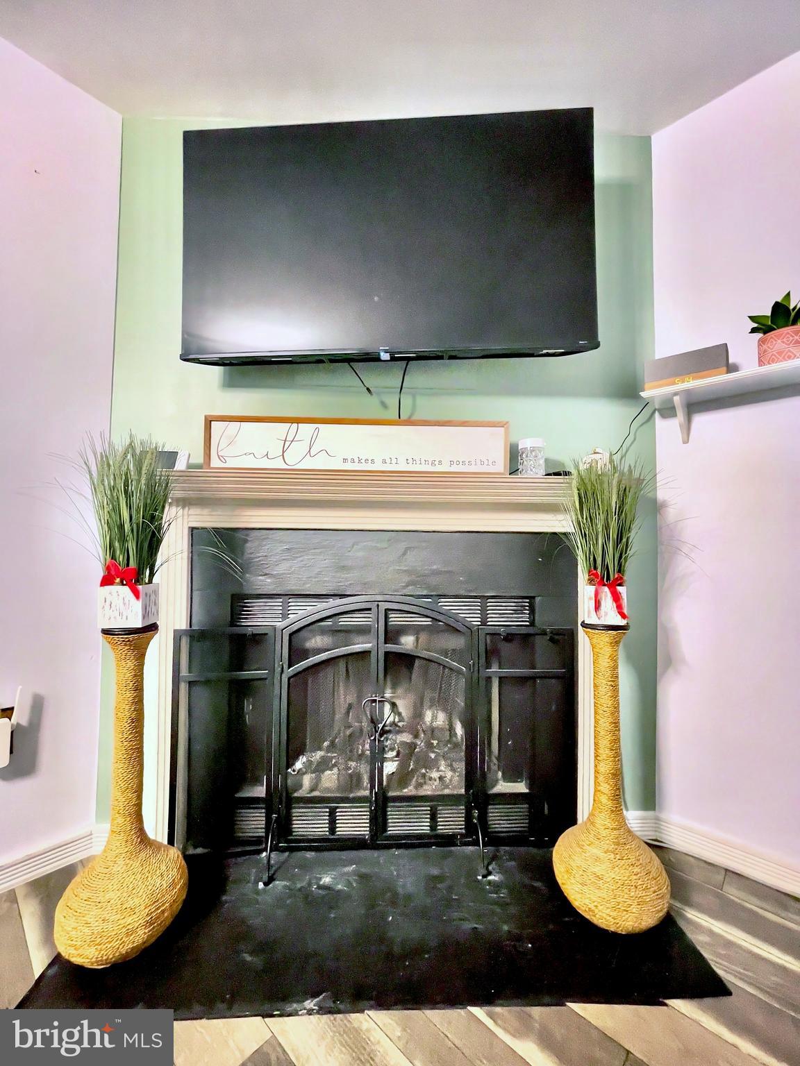 6852 Carnation Circle Frederick, MD 21703 - Photo 8 of 22 a living room with furniture and a fireplace