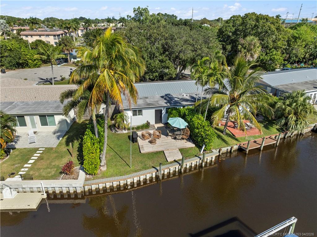 2446-2456 Southwest Hideaway Lane Stuart, FL 34994 - Photo 36 of 42 an aerial view of residential houses with outdoor space and river