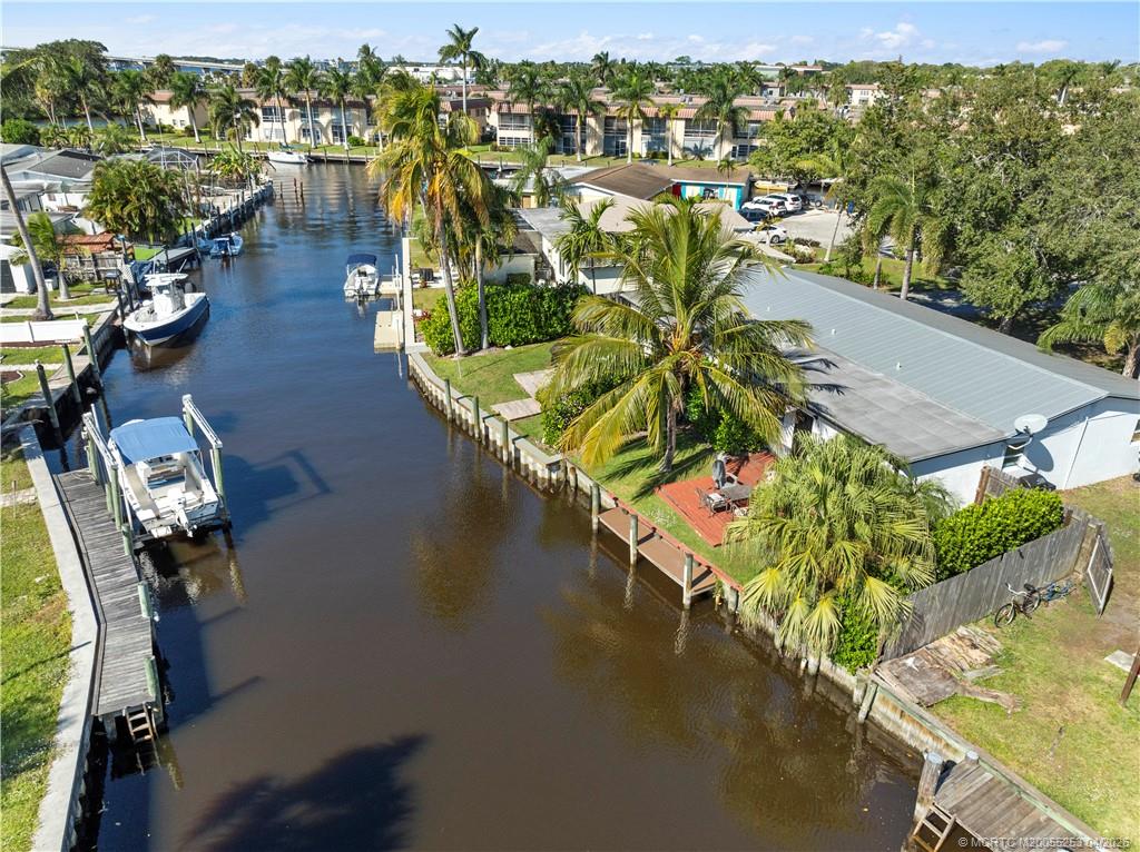 2446-2456 Southwest Hideaway Lane Stuart, FL 34994 - Photo 37 of 42 an aerial view of residential houses with outdoor space