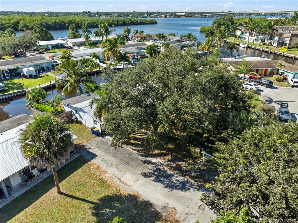 2446-2456 Southwest Hideaway Lane Stuart, FL 34994 - Photo 39 of 42 a view of a lake with a city
