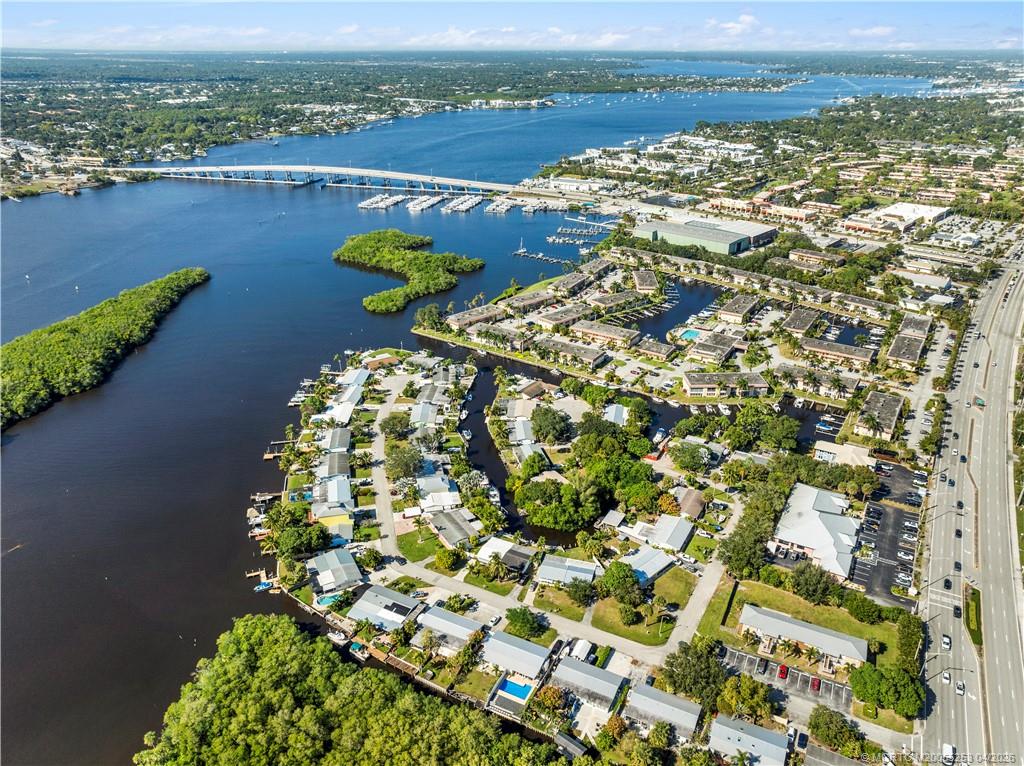 2446-2456 Southwest Hideaway Lane Stuart, FL 34994 - Photo 42 of 42 a view of a lake with a mountain in the background
