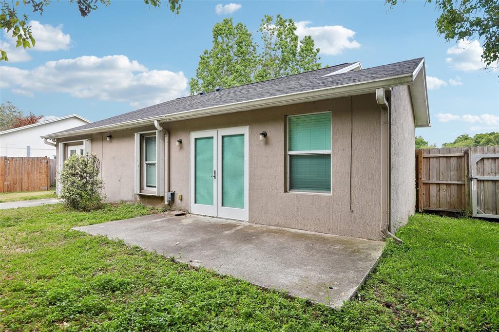 1525 Kestrel Way Brandon, FL 33511 - Photo 43 of 48 a view of a house with a yard and garage