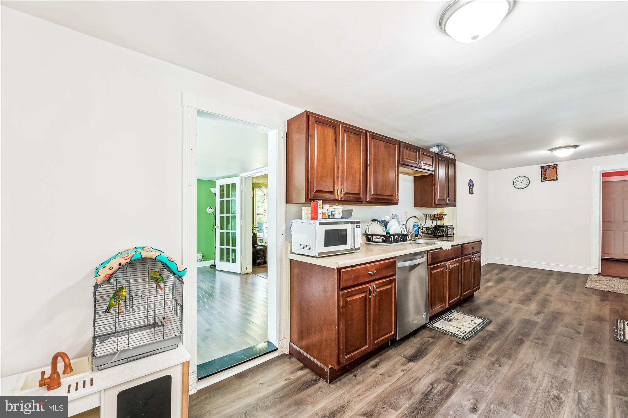 9502 Brandywine Road Clinton, MD 20735 - Photo 11 of 21 a kitchen with stainless steel appliances granite countertop a stove cabinets and wooden floor