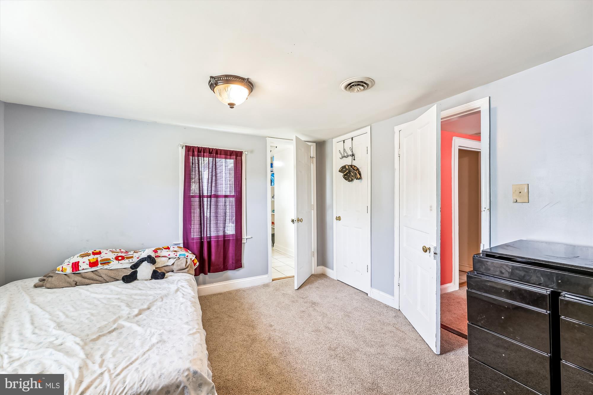 9502 Brandywine Road Clinton, MD 20735 - Photo 14 of 21 a bedroom with a bed and a dresser