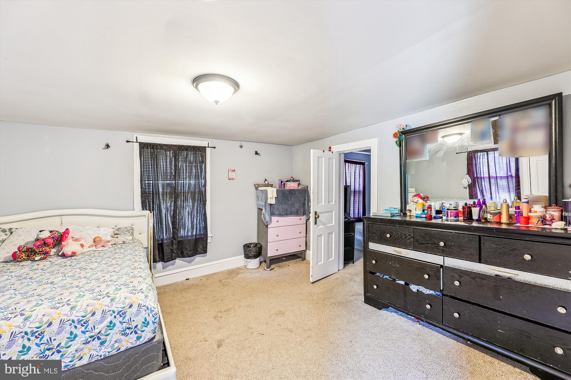 9502 Brandywine Road Clinton, MD 20735 - Photo 15 of 21 a bed room with a bed and a dresser