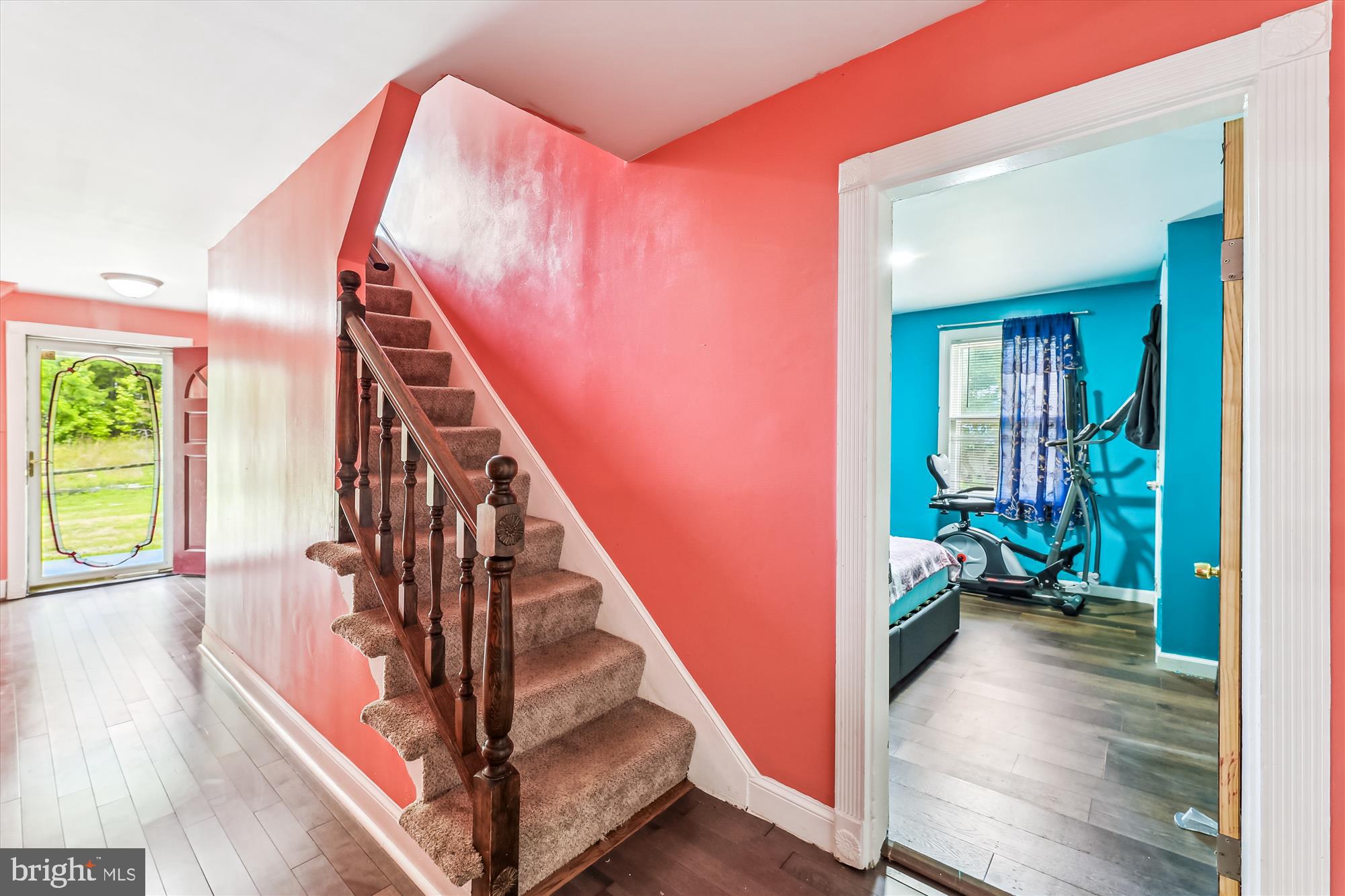 9502 Brandywine Road Clinton, MD 20735 - Photo 6 of 21 a view of a hallway with wooden floor and staircase