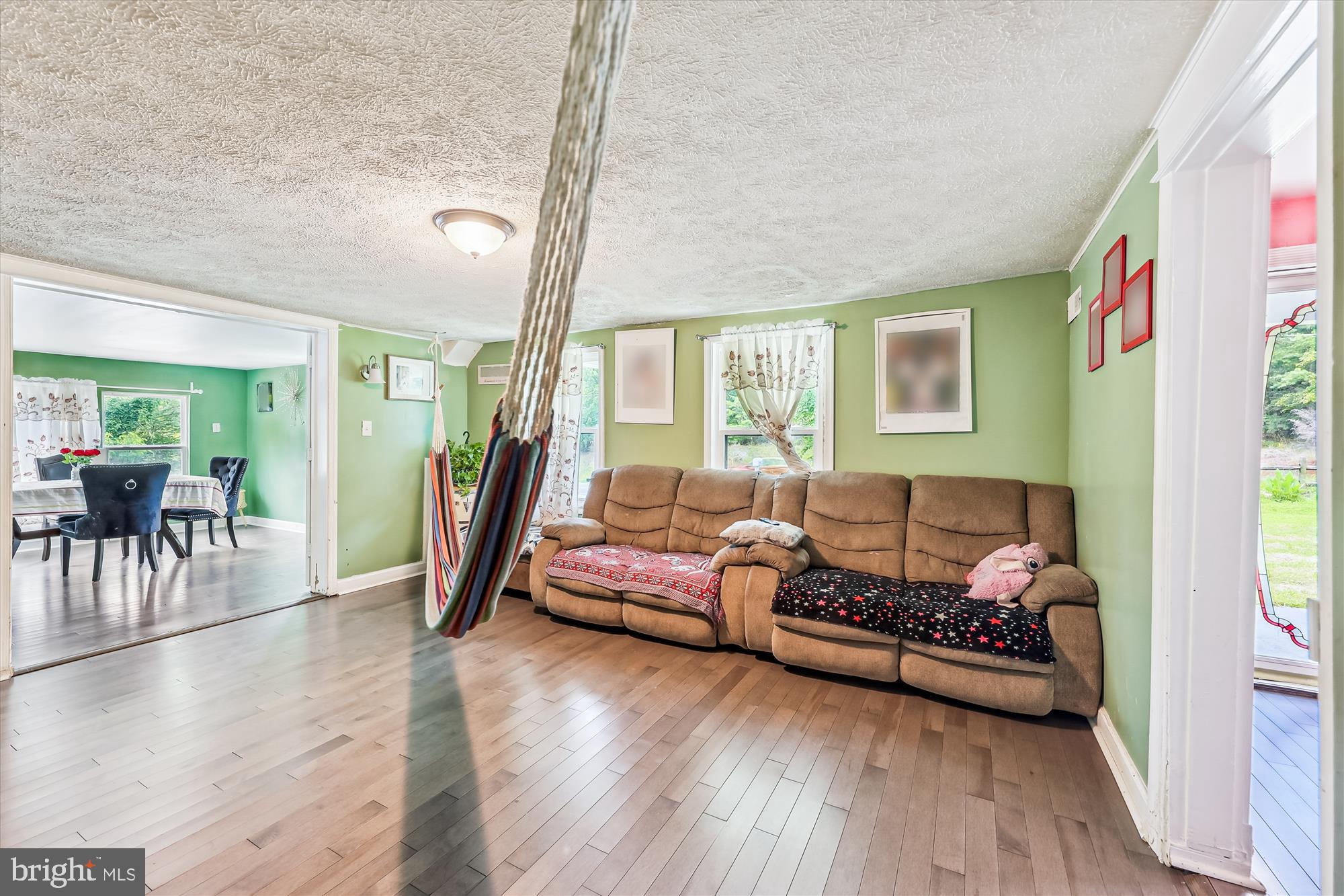 9502 Brandywine Road Clinton, MD 20735 - Photo 8 of 21 a living room with furniture and a wooden floor