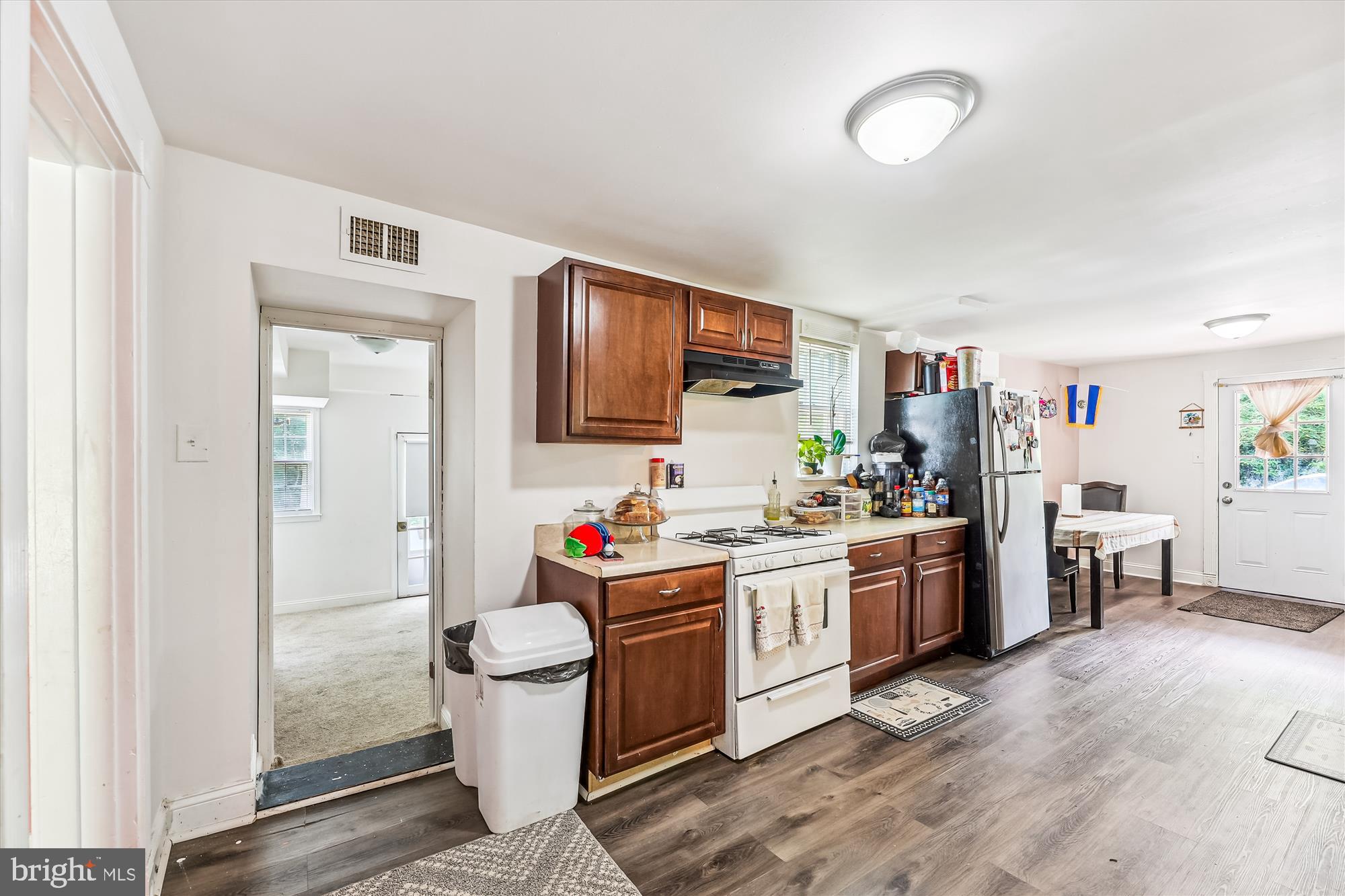 9502 Brandywine Road Clinton, MD 20735 - Photo 10 of 21 a kitchen with kitchen island a sink stove and refrigerator