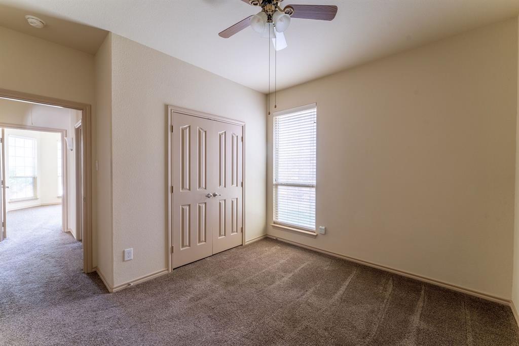 11156 Hawks Landing Road Fort Worth, TX 76052 - Photo 13 of 30 Neutral wall tones with a ceiling fan, carpeted flooring, and a window with blinds