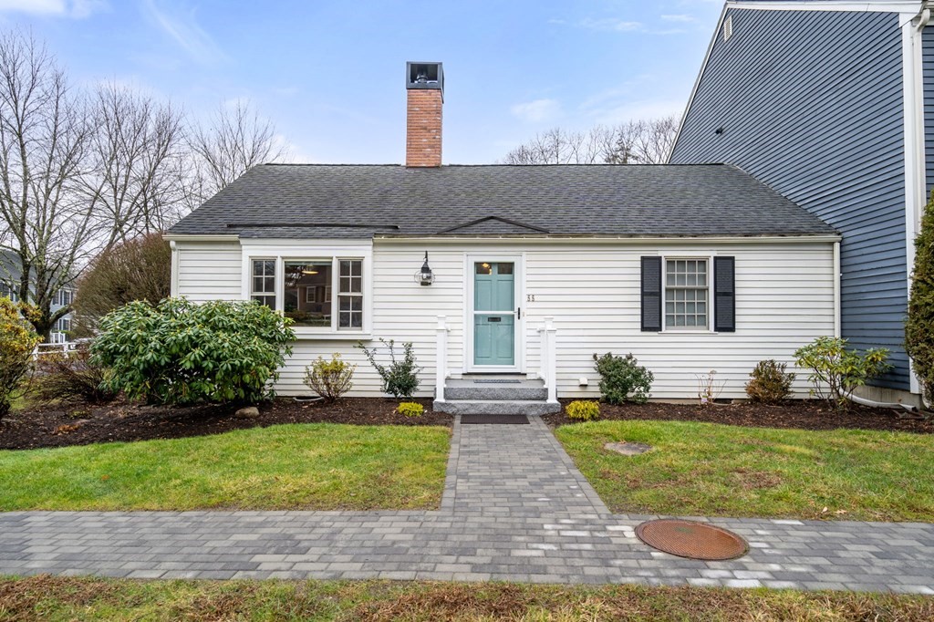 55 Jericho Road, Unit 55 Weston, MA 02493 - Photo 1 of 24 a front view of a house with a yard