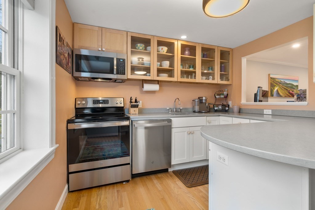 55 Jericho Road, Unit 55 Weston, MA 02493 - Photo 12 of 24 a kitchen with a stove microwave and sink