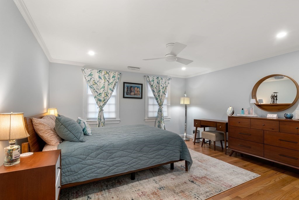 55 Jericho Road, Unit 55 Weston, MA 02493 - Photo 13 of 24 a bedroom with a bed window and a dresser