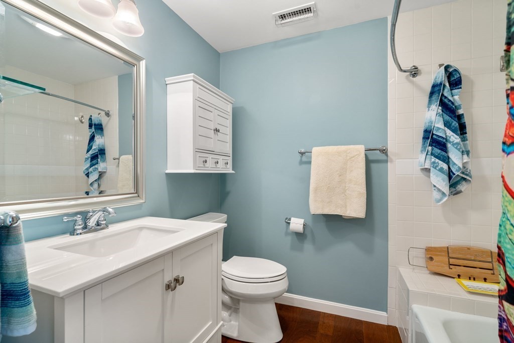 55 Jericho Road, Unit 55 Weston, MA 02493 - Photo 19 of 24 a bathroom with a sink mirror vanity and toilet