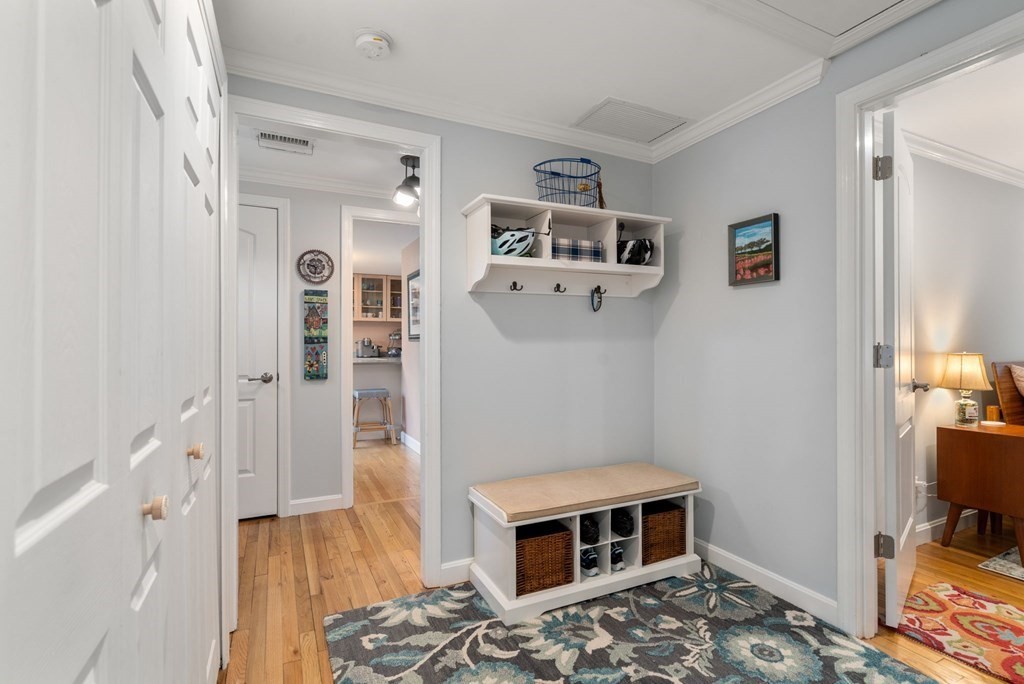 55 Jericho Road, Unit 55 Weston, MA 02493 - Photo 20 of 24 a bedroom with bed and wooden floor