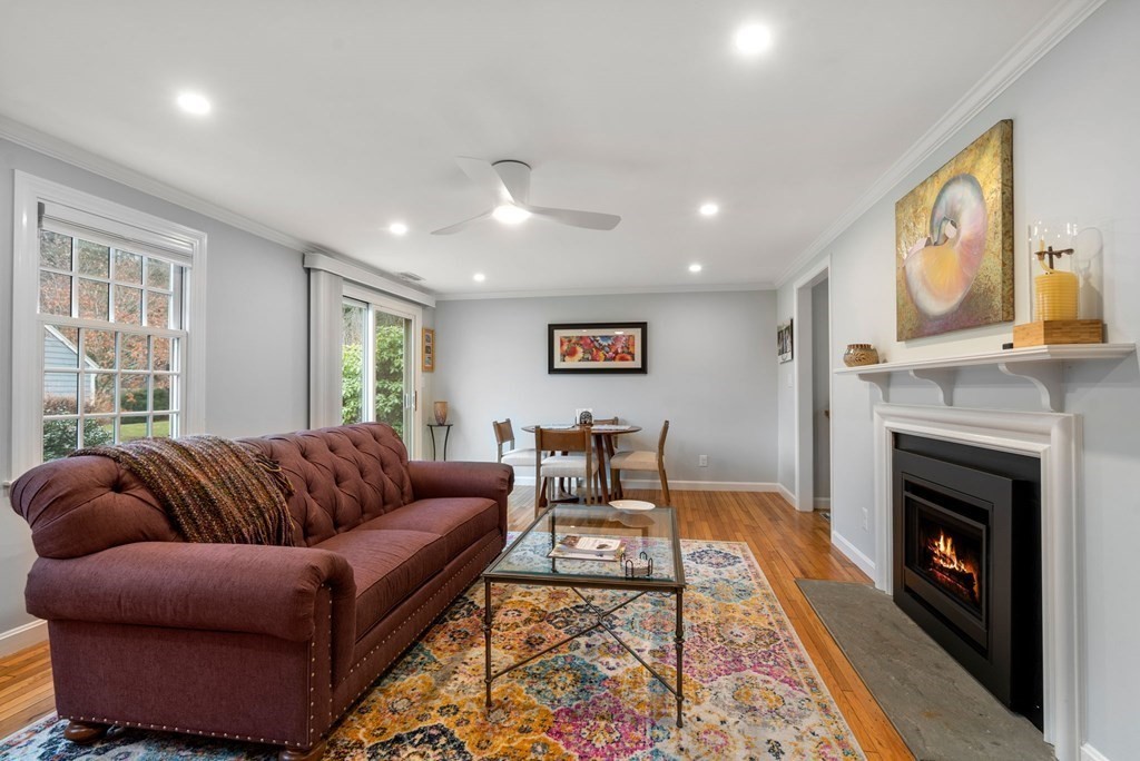 55 Jericho Road, Unit 55 Weston, MA 02493 - Photo 2 of 24 a living room with furniture fireplace and window