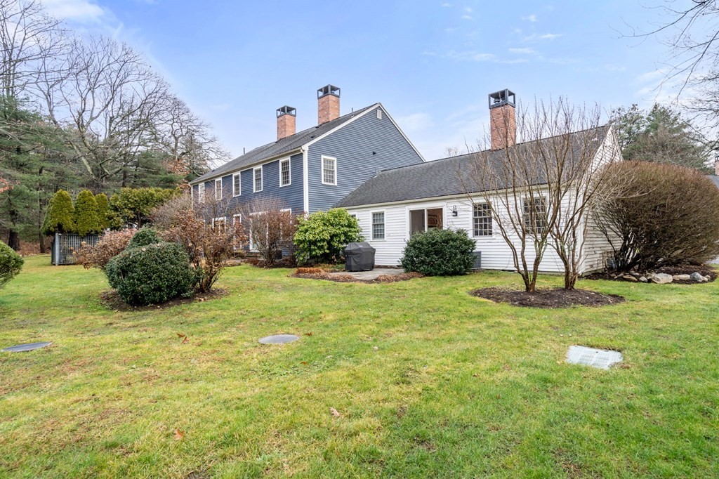 55 Jericho Road, Unit 55 Weston, MA 02493 - Photo 21 of 24 a front view of a house with garden