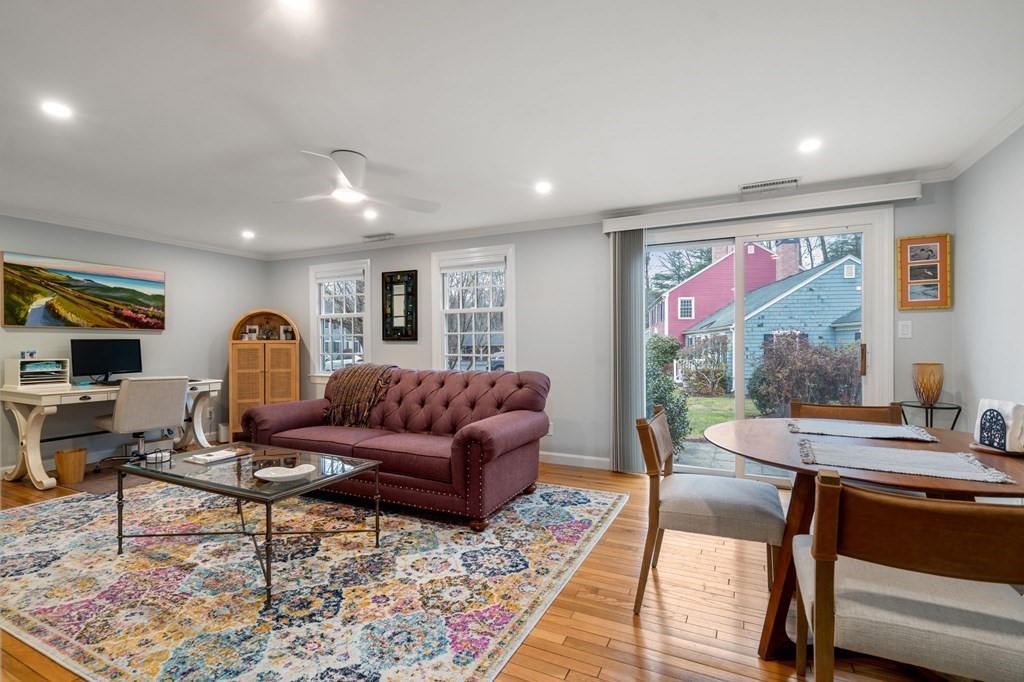 55 Jericho Road, Unit 55 Weston, MA 02493 - Photo 3 of 24 a living room with furniture and a flat screen tv