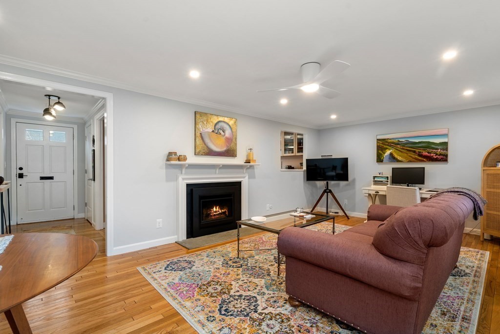 55 Jericho Road, Unit 55 Weston, MA 02493 - Photo 5 of 24 a living room with furniture and a fireplace