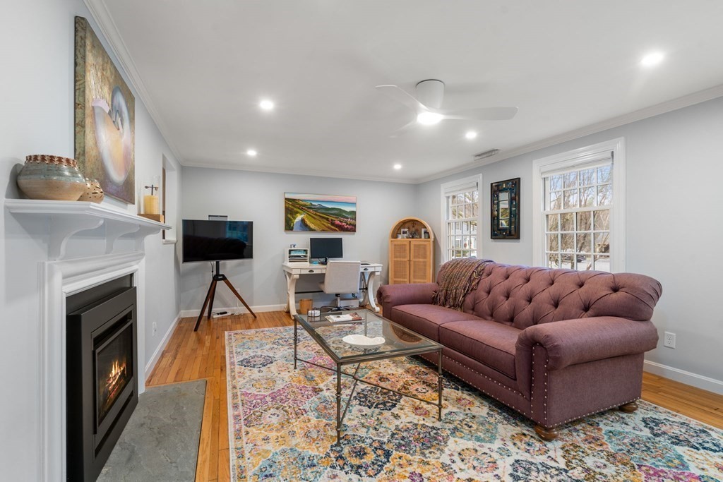 55 Jericho Road, Unit 55 Weston, MA 02493 - Photo 6 of 24 a living room with furniture and a fireplace