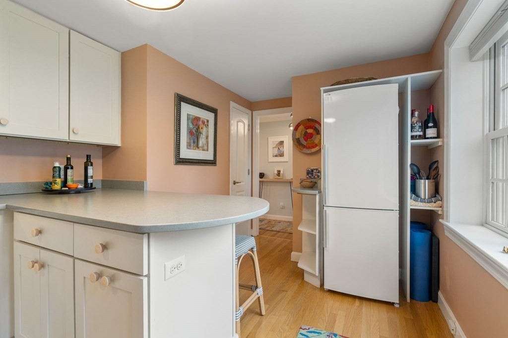 55 Jericho Road, Unit 55 Weston, MA 02493 - Photo 8 of 24 a kitchen with a refrigerator and a sink