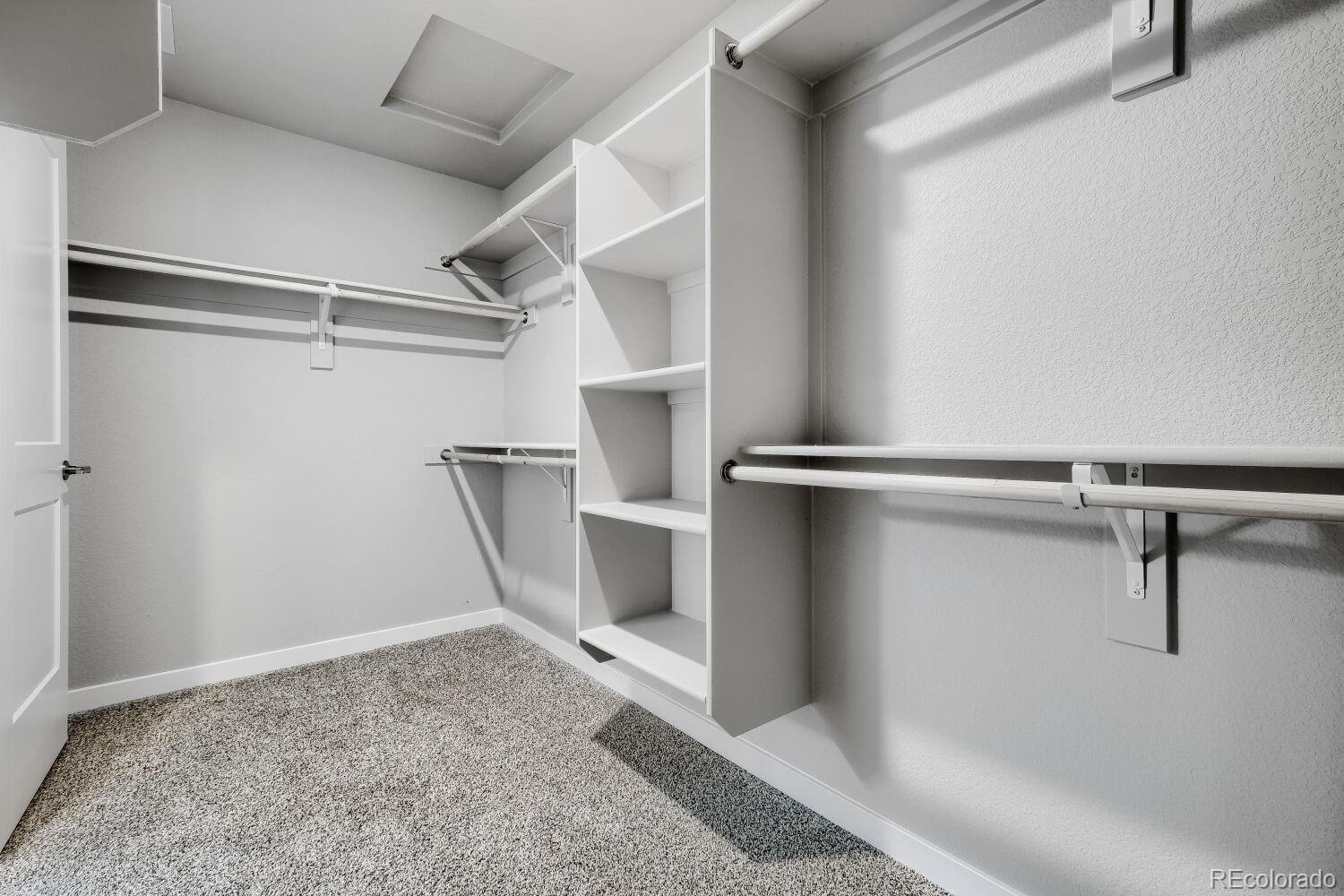 471 Atchison Way Calhan, CO 80808 - Photo 26 of 31 a view of a room with racks on the wall