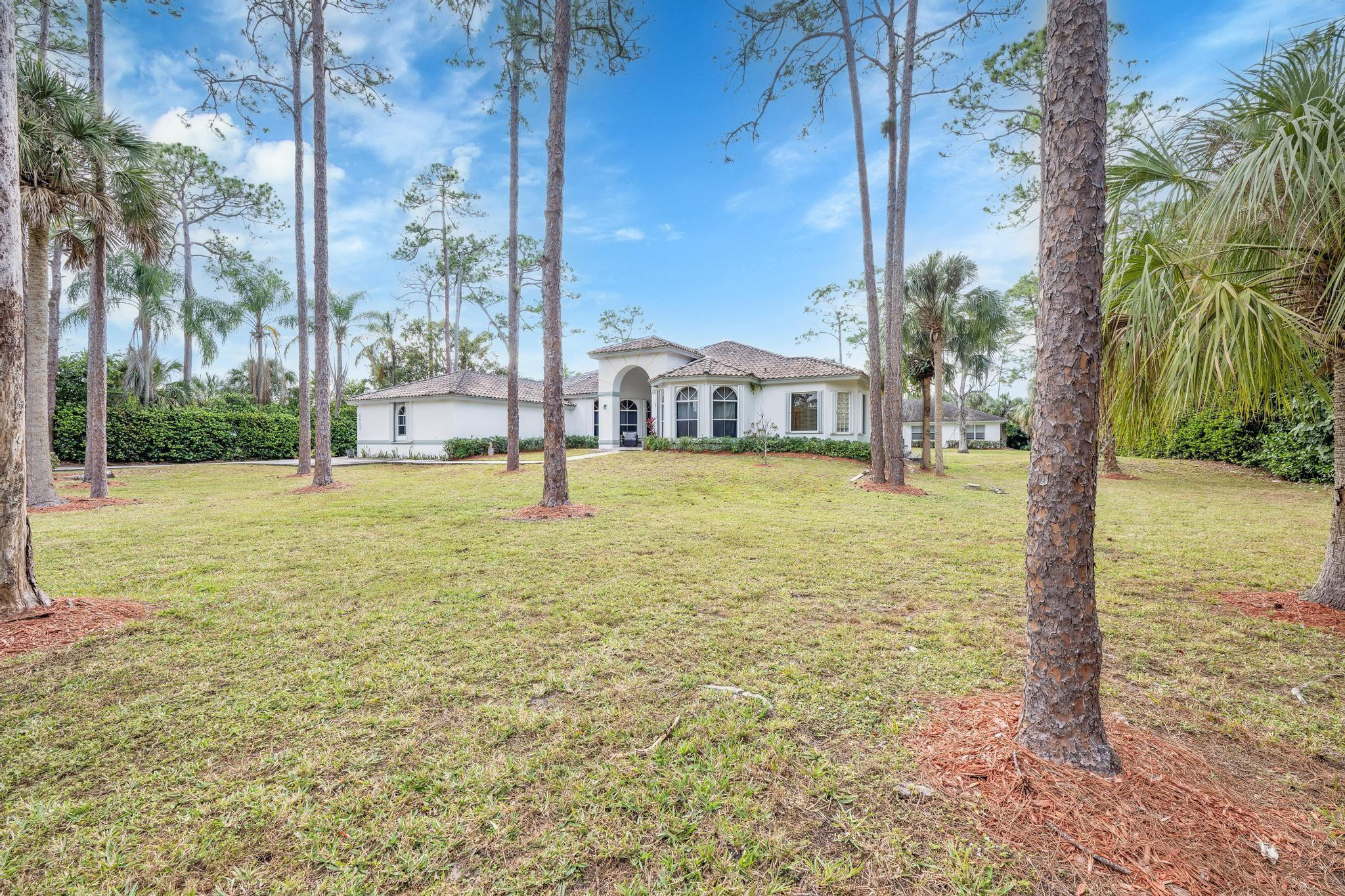 4901 Godfrey Road Parkland, FL 33067 - Photo 18 of 60 a view of a city with tall trees