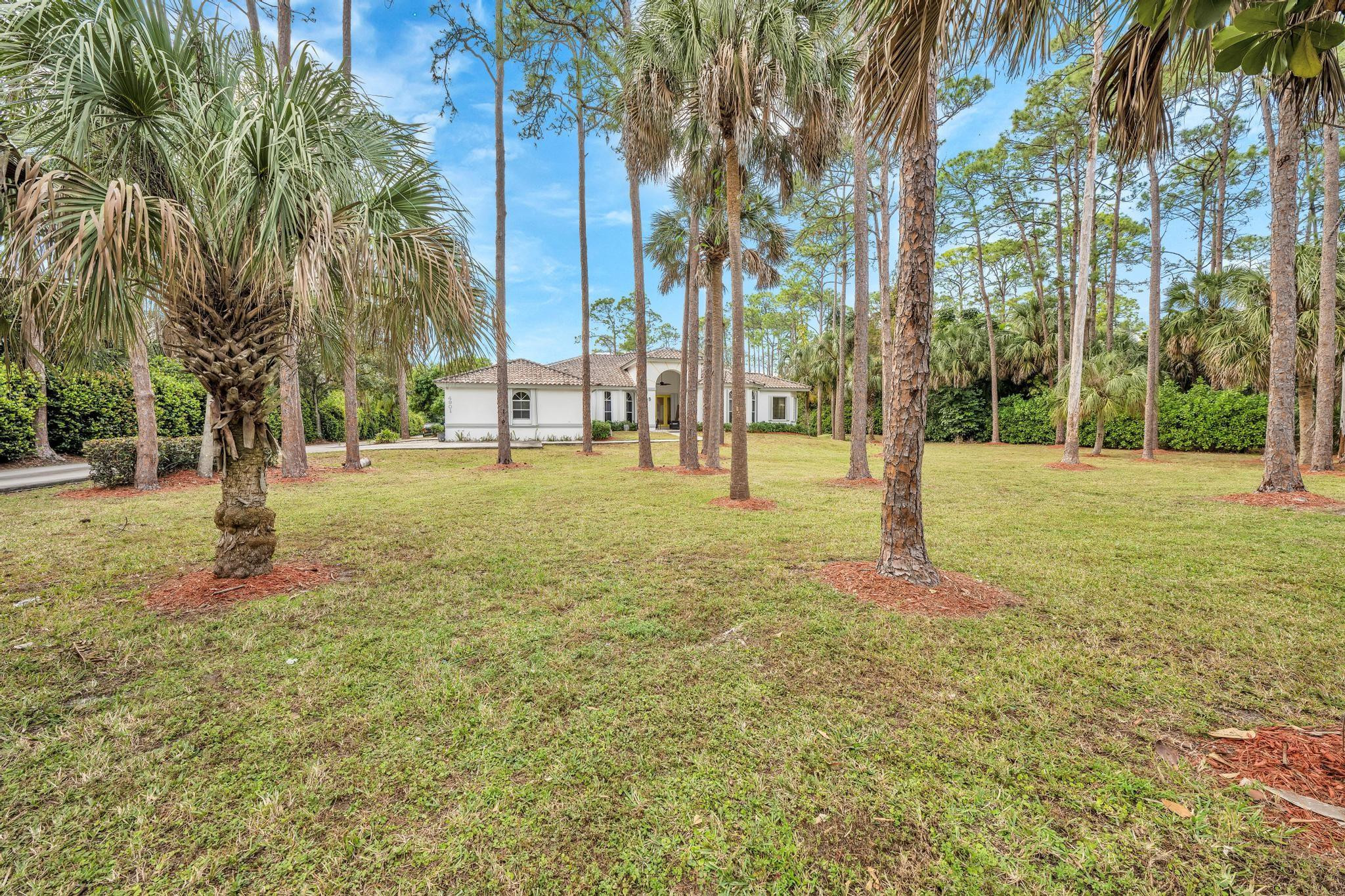 4901 Godfrey Road Parkland, FL 33067 - Photo 20 of 60 a view of a park with palm trees
