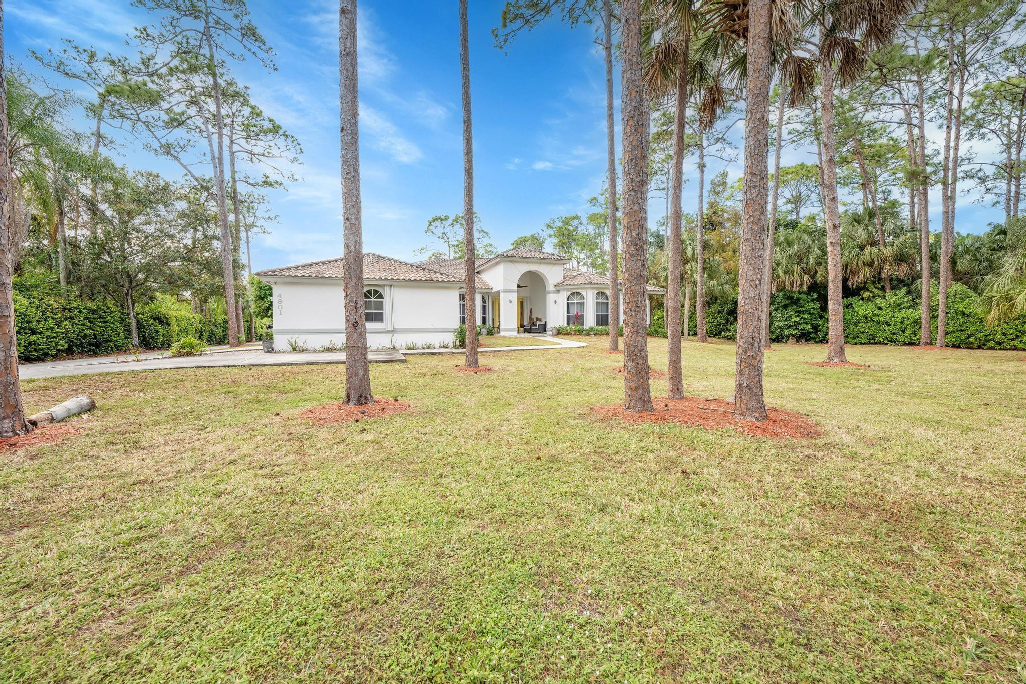 4901 Godfrey Road Parkland, FL 33067 - Photo 26 of 60 a view of a building with a yard