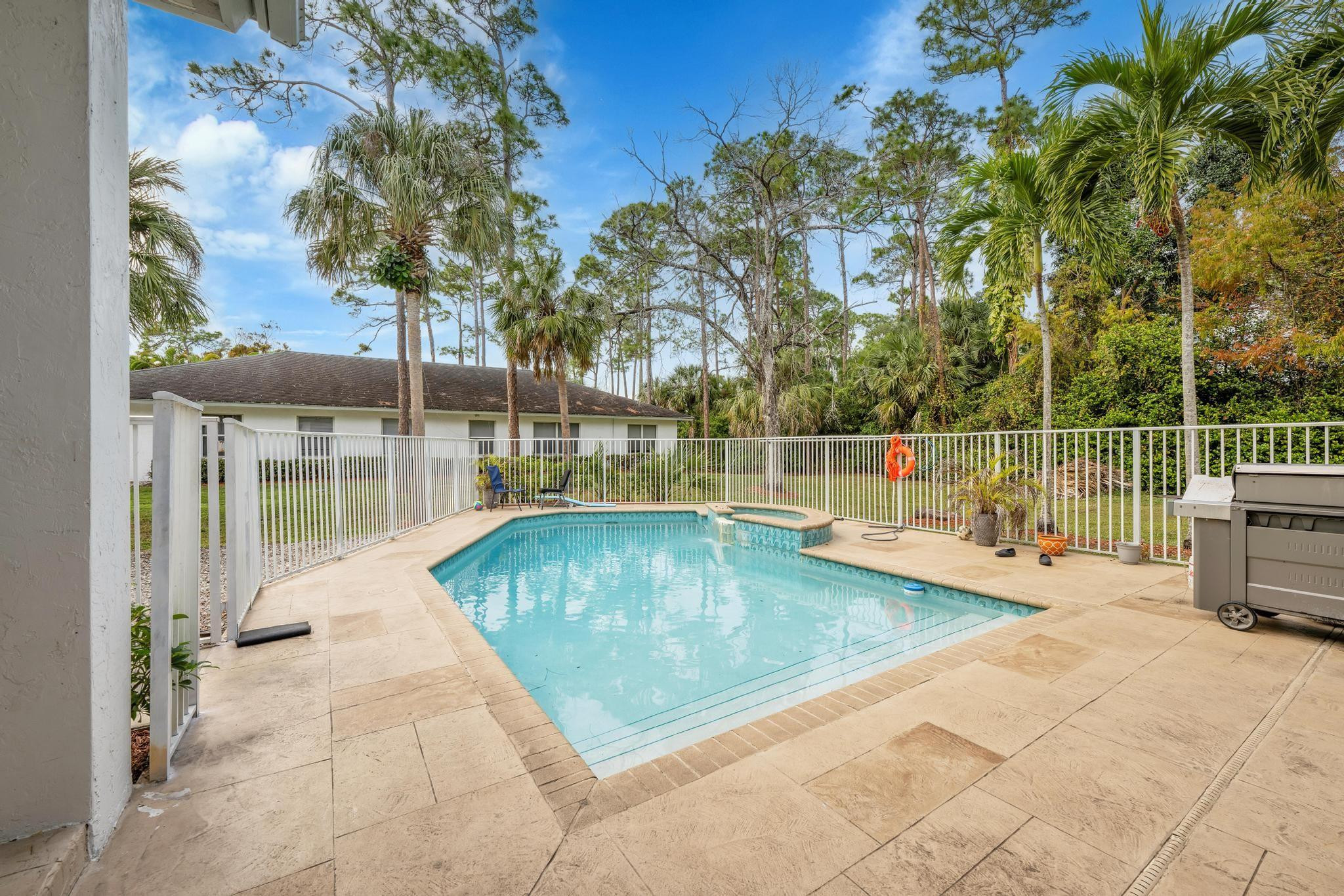 4901 Godfrey Road Parkland, FL 33067 - Photo 28 of 60 swimming pool view with a seating space
