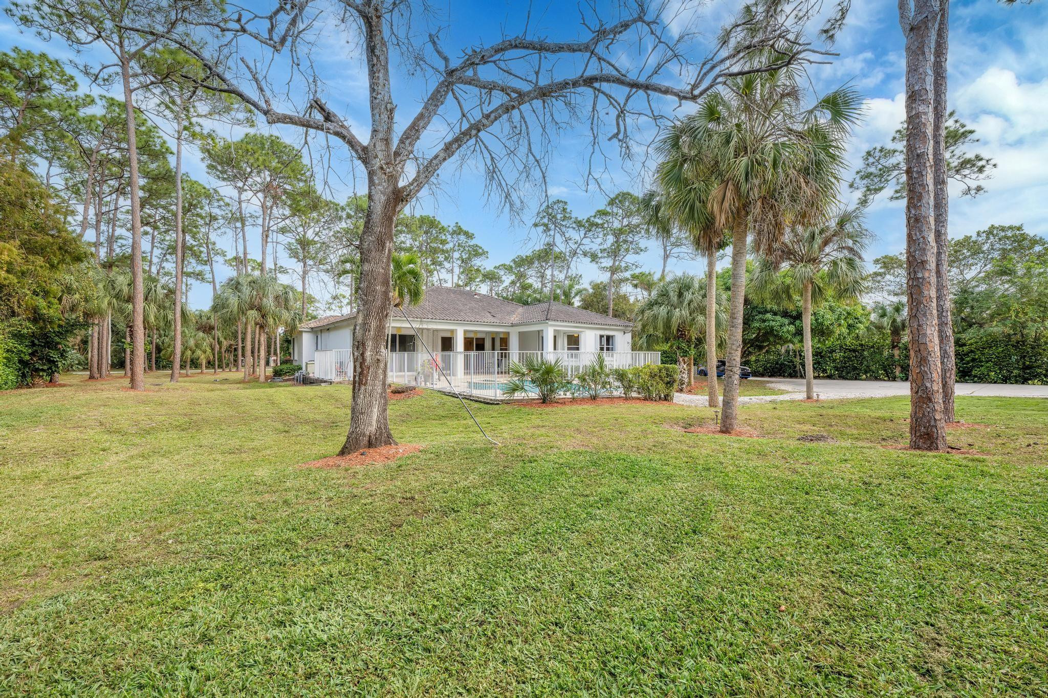 4901 Godfrey Road Parkland, FL 33067 - Photo 29 of 60 a view of a house with a yard