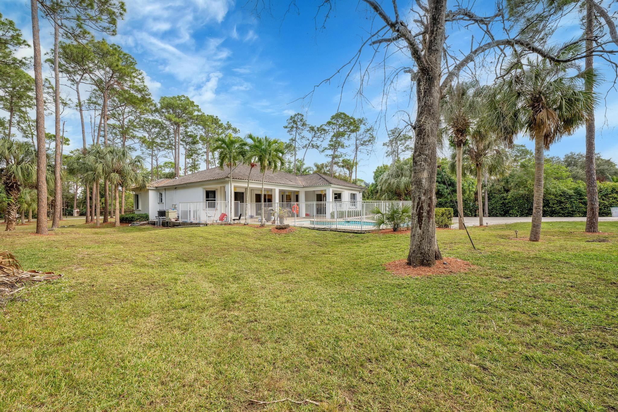 4901 Godfrey Road Parkland, FL 33067 - Photo 31 of 60 a view of a house with a yard