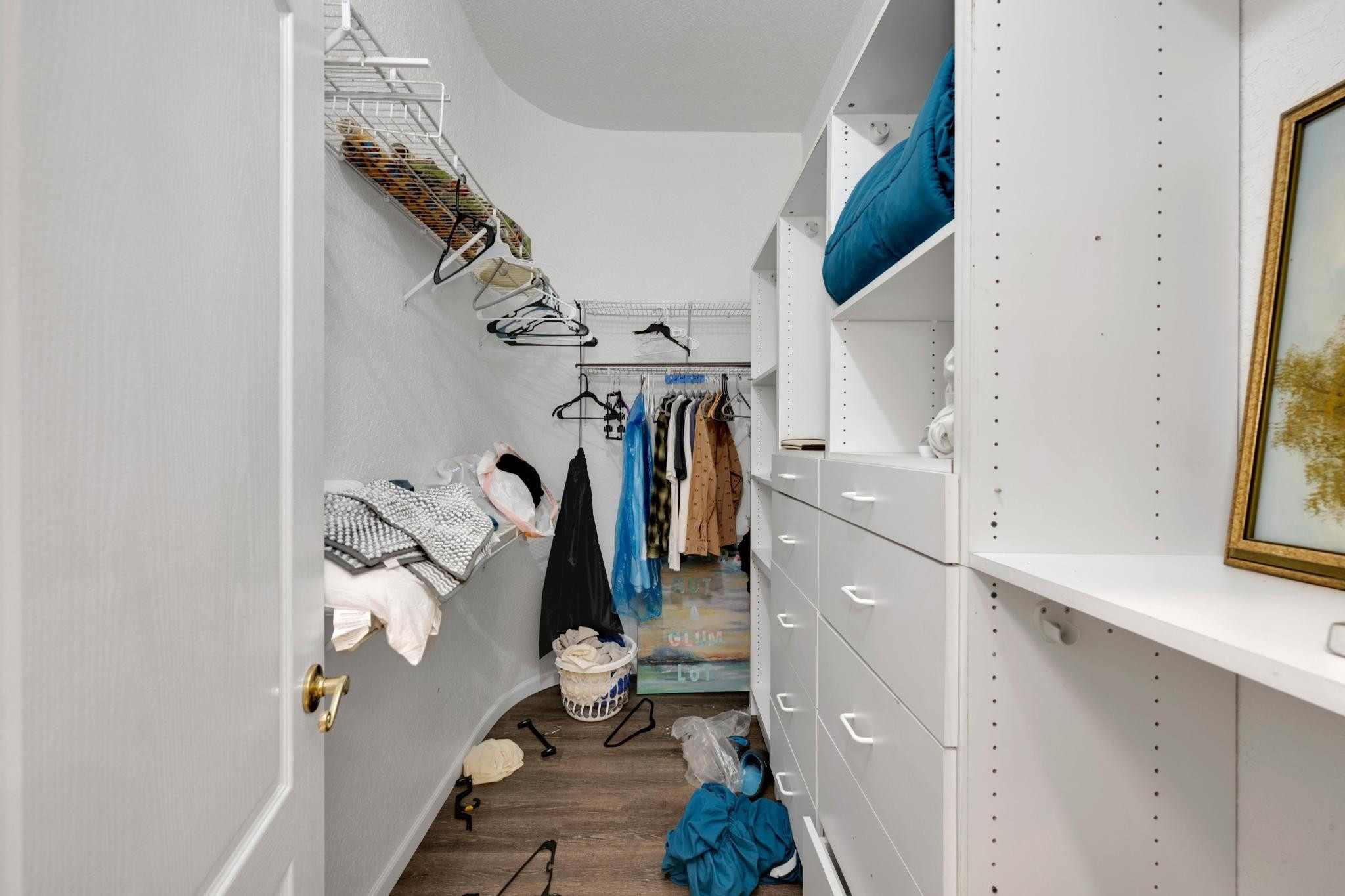 4901 Godfrey Road Parkland, FL 33067 - Photo 42 of 60 a view of walk in closet with clothes and shoes
