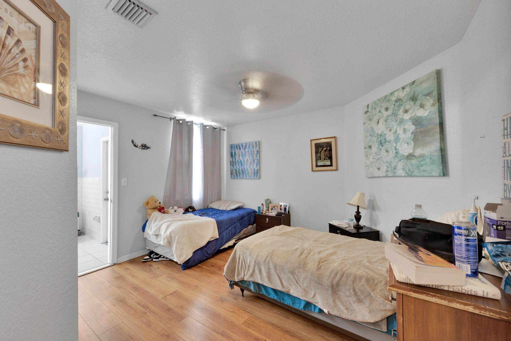 4901 Godfrey Road Parkland, FL 33067 - Photo 44 of 60 a bedroom with two beds and a desk